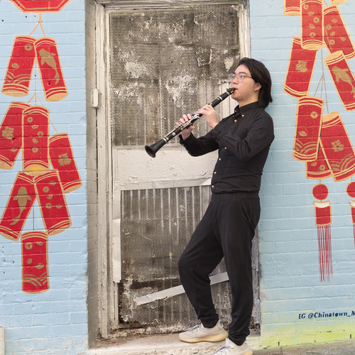 Student with instrument outside