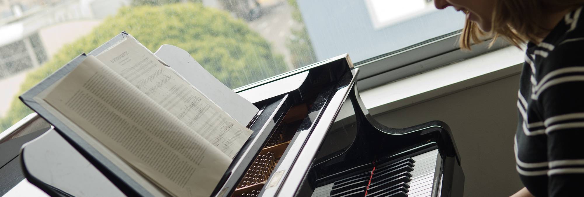 picture of a keyboard and a practice room window