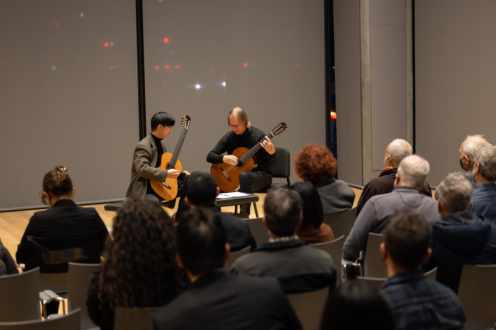 David Russell Teaches a student in a masterclass setting