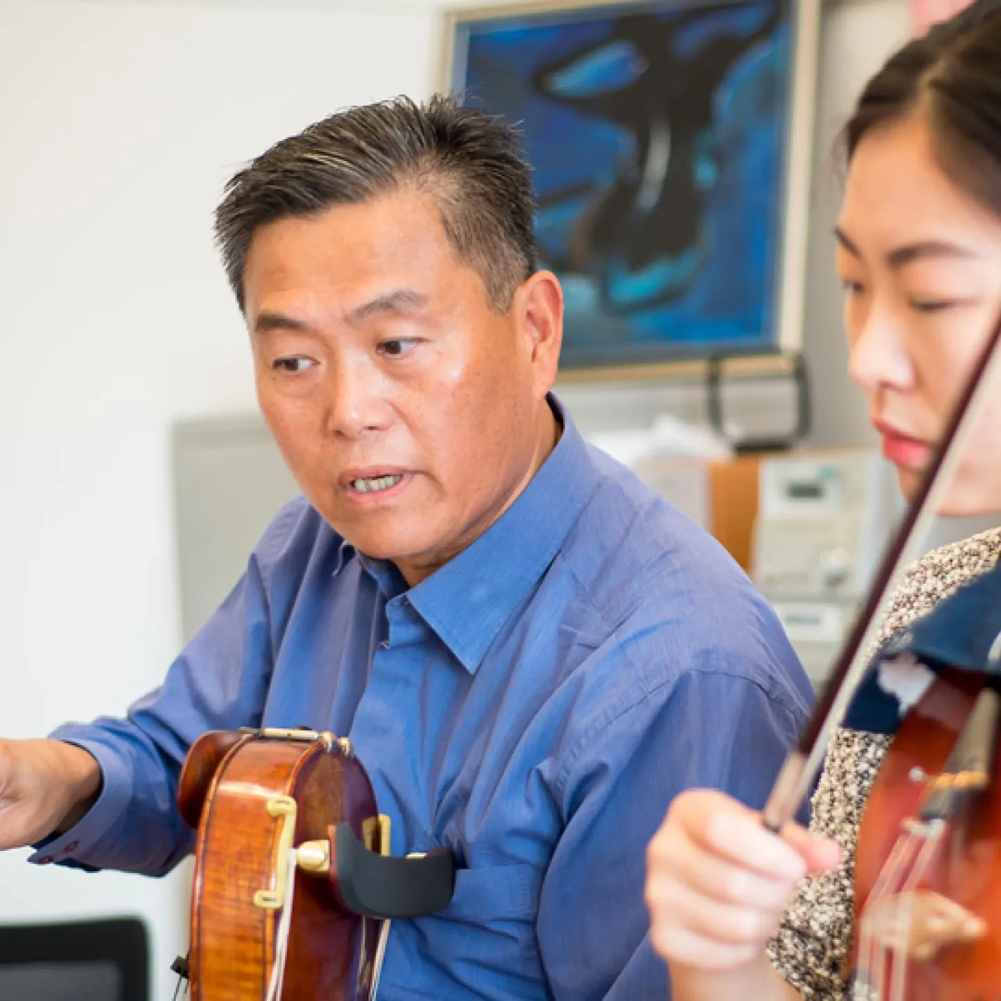 SFCM faculty teaching a student