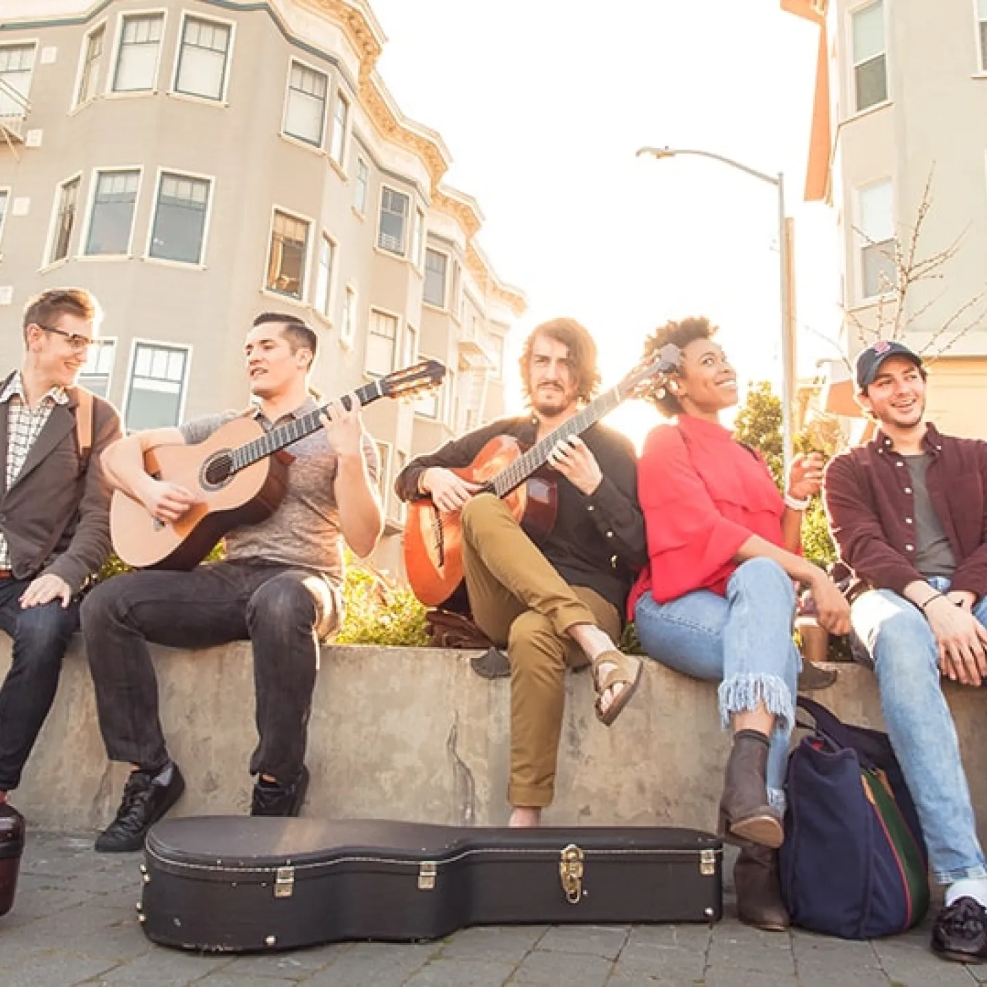 Students guitarists posing for evening photo in Patricia Green park Octavia St