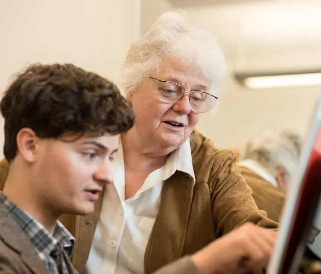 Elinor Armer works with a student.