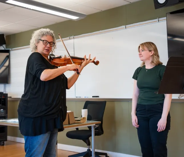Kay Stern with a student.