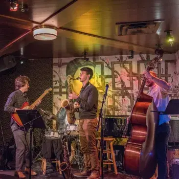 a band plays at an alumni party