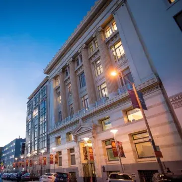 facade of 50 oak at dusk