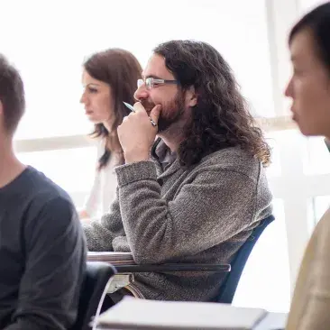 a student sits at a desk in class