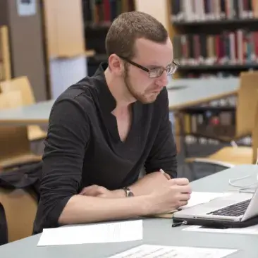 a student at their computer in the library