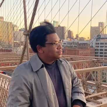 Tyson Davis on a bridge looking at the scenery