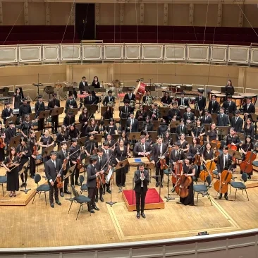 Jaco Wong with the Harker School Orchestra in Chicago.