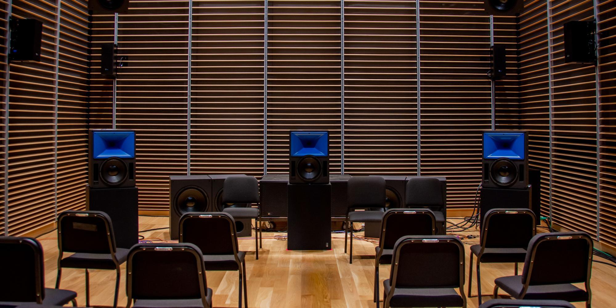 speakers in studio g around chairs