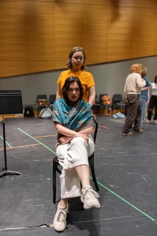Cora-Melin Mikat (standing) and Melanie Athans rehearse 'Anon.'