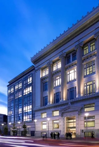 facade of 50 oak street building as dusk