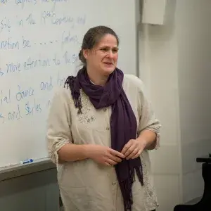 Melita Denny headshot while lecturing