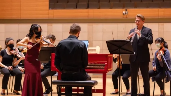 an oboist and a violinist perform a concerto together for a winter term project