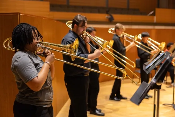 The Chromatic Brass Collective rehearses alongside students.