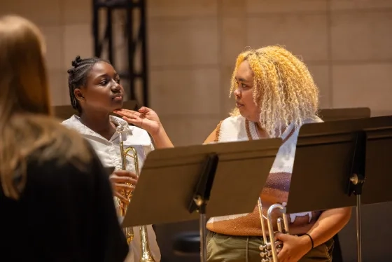 CBC member Imani Duhe works with a student.