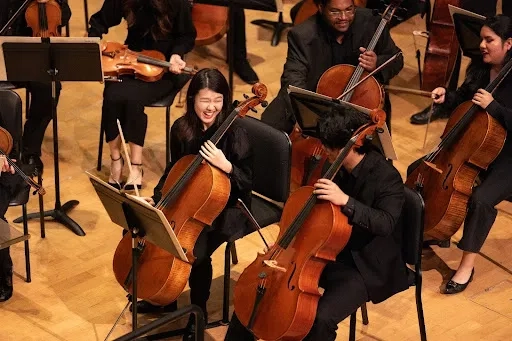 SFCM Students in the Orchestra smiling