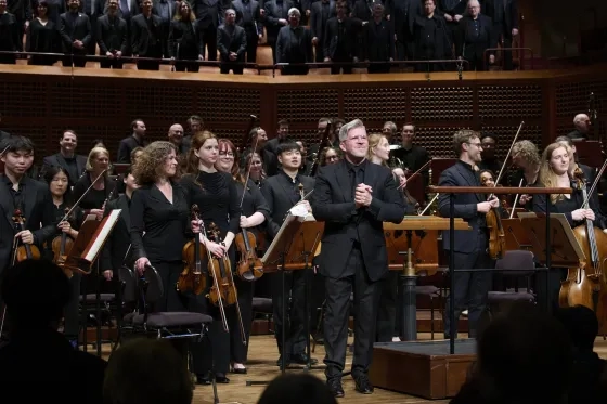 Edwin Outwater (center) and Fiona Cunninghame-Murray (middle left) onstage at Davies Symphony Hall.