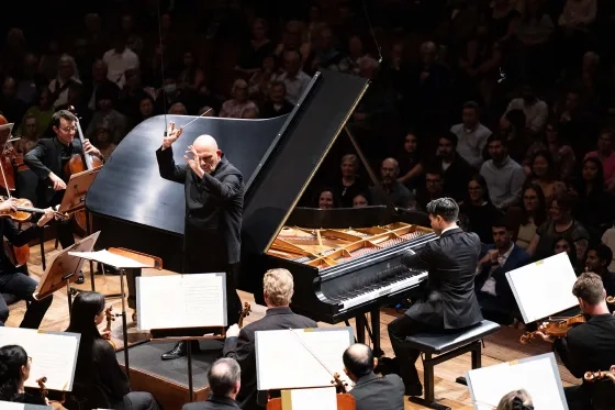 Parker Van Ostrand, conductor Jaap van Zweden, and the San Francisco Symphony. 
