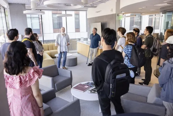 KDFC Production Manager Stephen Page (middle) and TAC faculty Matt Levine (right, in blue shirt) take SFCM students on a tour of KDFC.