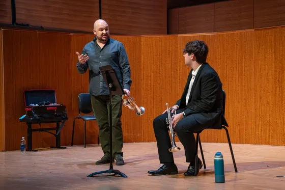 Esteban Batallán works with student Jordan Ku.