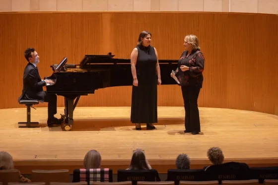 Student Lanie Anthan works with Pat Racette.