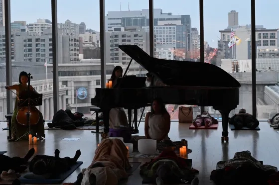 Audience members relax in the 11th floor Barbro Osher Recital Hall. 
