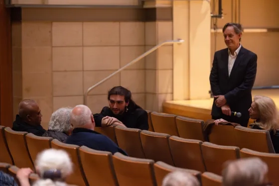 Student B Schaubhut (seated) and Jake Heggie. 