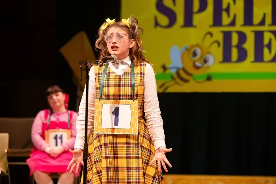 Student Katie Ivie performs as Logainne Schwartzandgrubenierre.