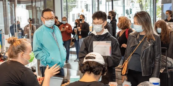 Oliver Wang ’24 and his parents at the check-in counter.