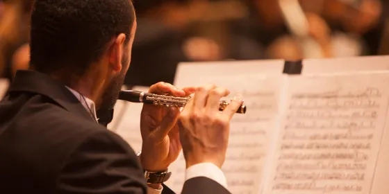 A student playing a piccolo