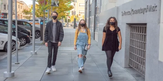 SFCM students wearing masks outside 50 Oak building