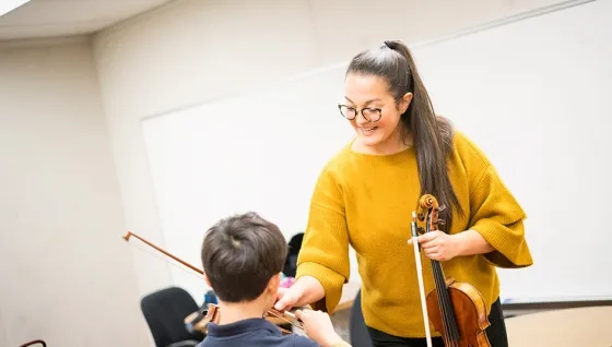 An SFCM student teaching within the community