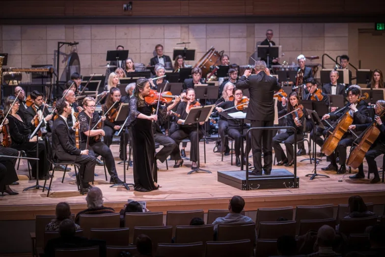 Strings perform with orchestra