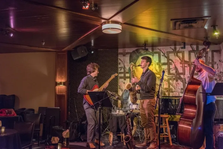 a band plays at an alumni party