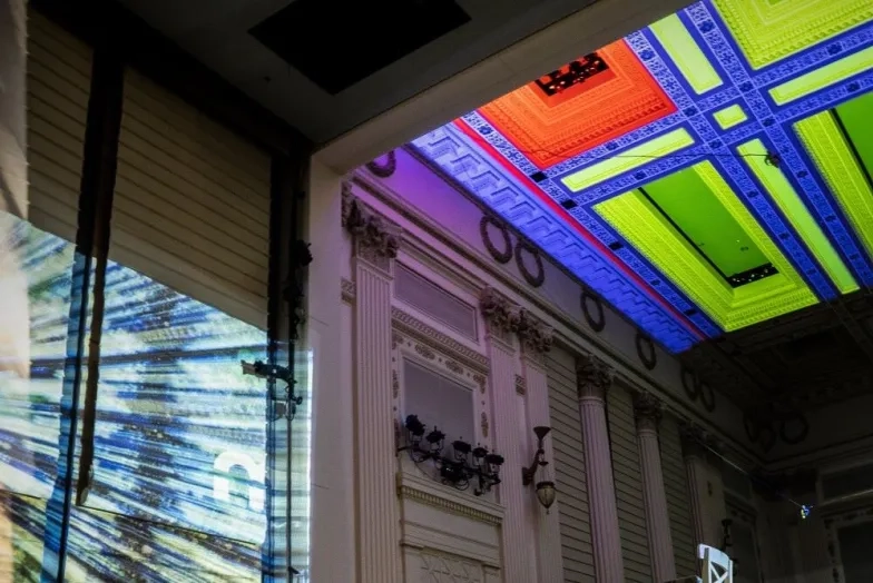 The concert hall lit up by different colors and projections
