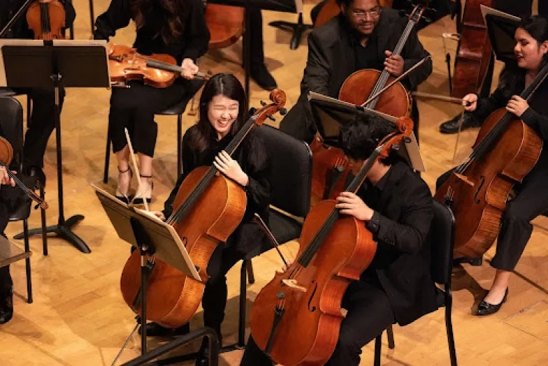 SFCM Students in the Orchestra smiling
