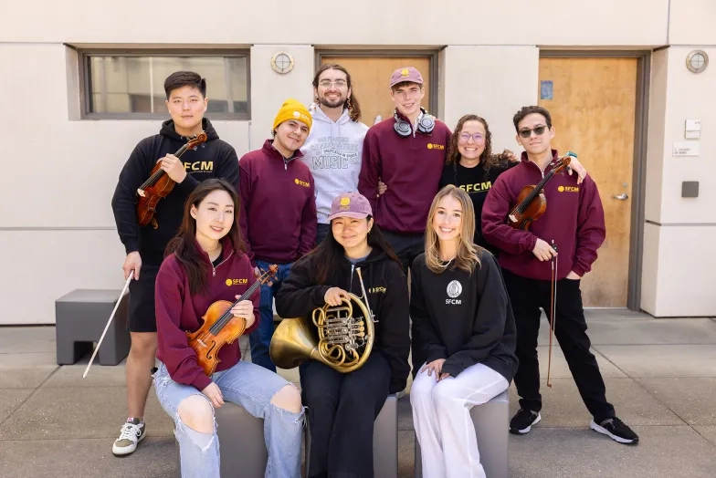 SFCM students show off merch in the Ann Getty Center.
