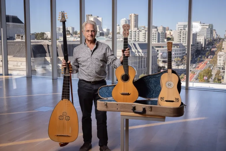 Richard Savino with three historical guitars.