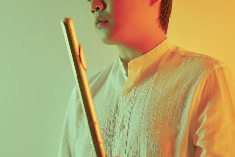 Yubeen Kim holding a flute