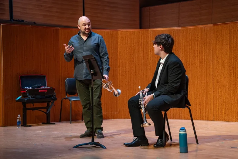 Esteban Batallán works with student Jordan Ku.