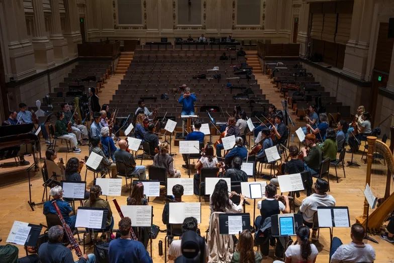 Students and SFBO musicians play in the Caroline H. Hume Concert Hall.