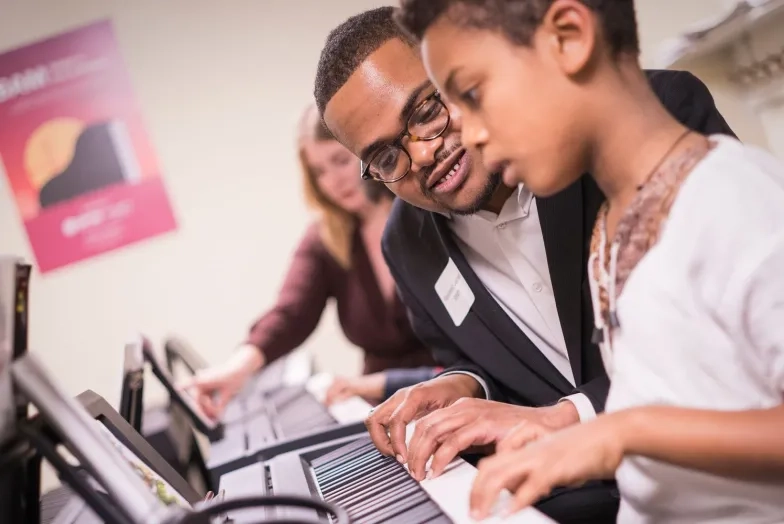 SFCM student working with Junior High Student in BAM program