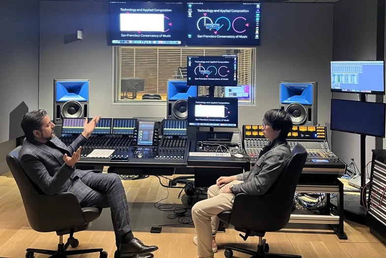 Ricky Kej works with a student in Studio G.