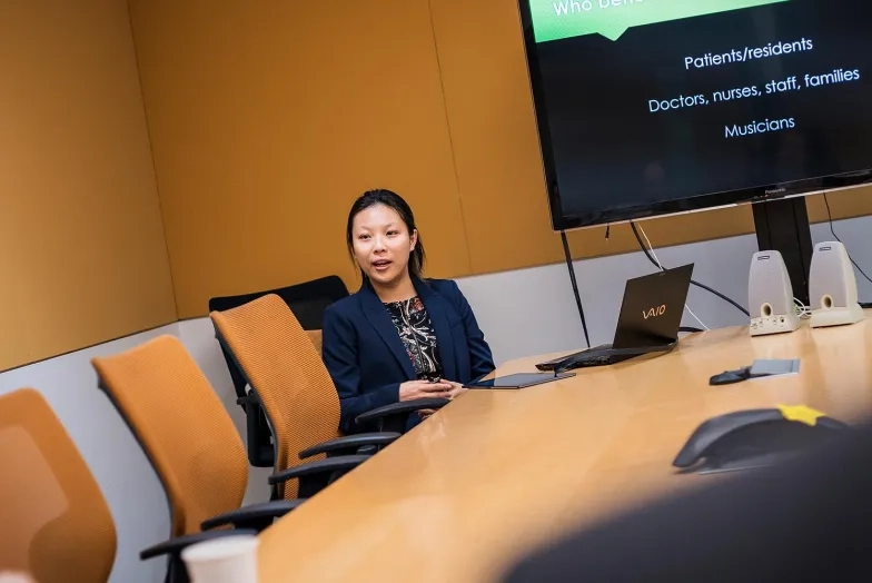A photo of a student making a presentation at SFCM