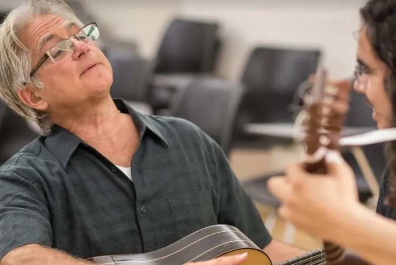 Richard Savino playing guitar