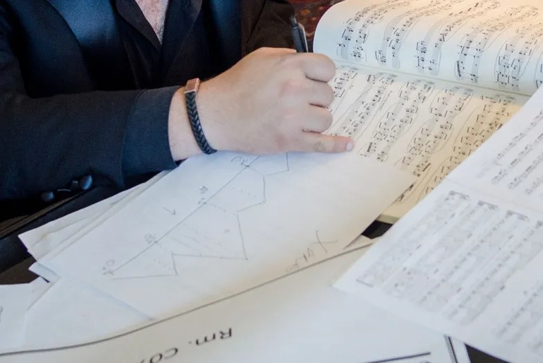 PDEC: student working on analysis of sheet music