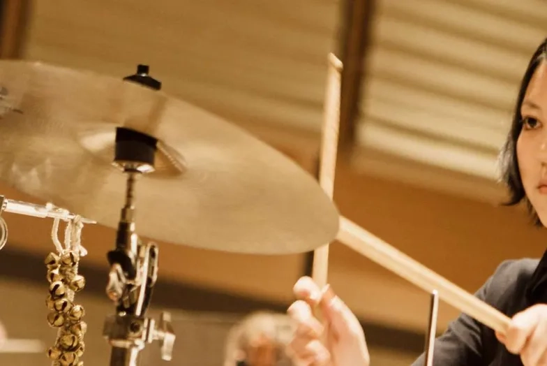 close up of a drum kit and a cymbal about the be struck