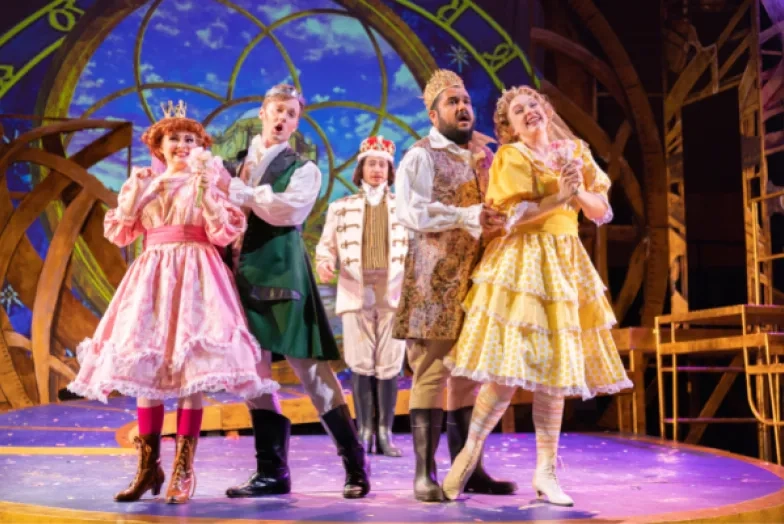 Students perform and opera in costume and on a nice set