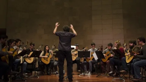 Guitar ensemble being conducted